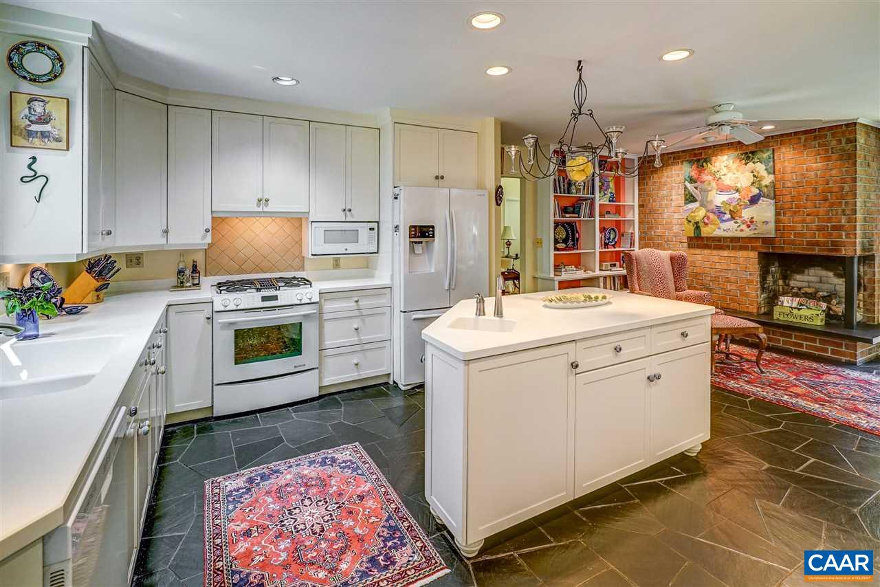 1075 Richmond Road Keswick, VA 22947 - Photo 22 of 50 a kitchen with a sink stove and refrigerator