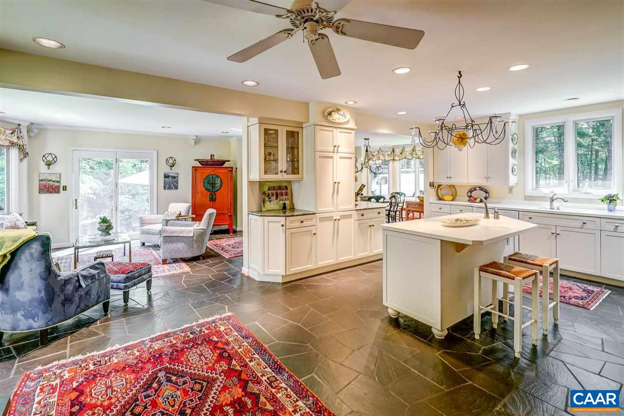 1075 Richmond Road Keswick, VA 22947 - Photo 23 of 50 a living room with stainless steel appliances kitchen island granite countertop furniture and a rug