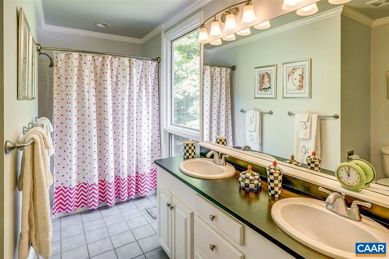 1075 Richmond Road Keswick, VA 22947 - Photo 32 of 50 a bathroom with a granite countertop double vanity and a mirror