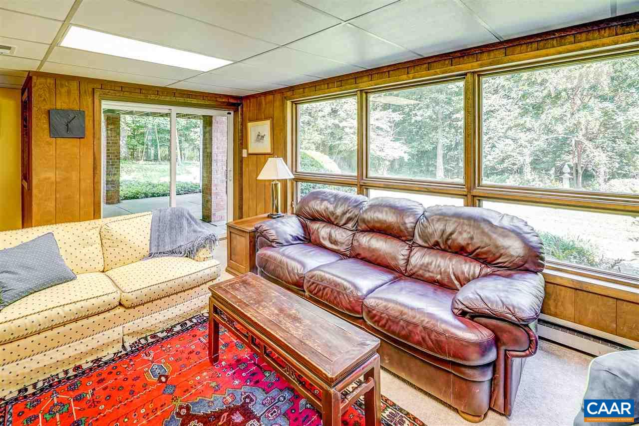 1075 Richmond Road Keswick, VA 22947 - Photo 37 of 50 a living room with furniture and a large window
