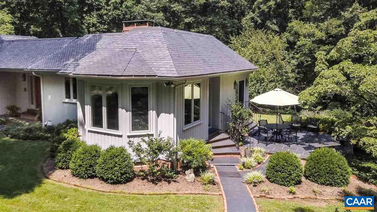 1075 Richmond Road Keswick, VA 22947 - Photo 4 of 50 a front view of a house with garden