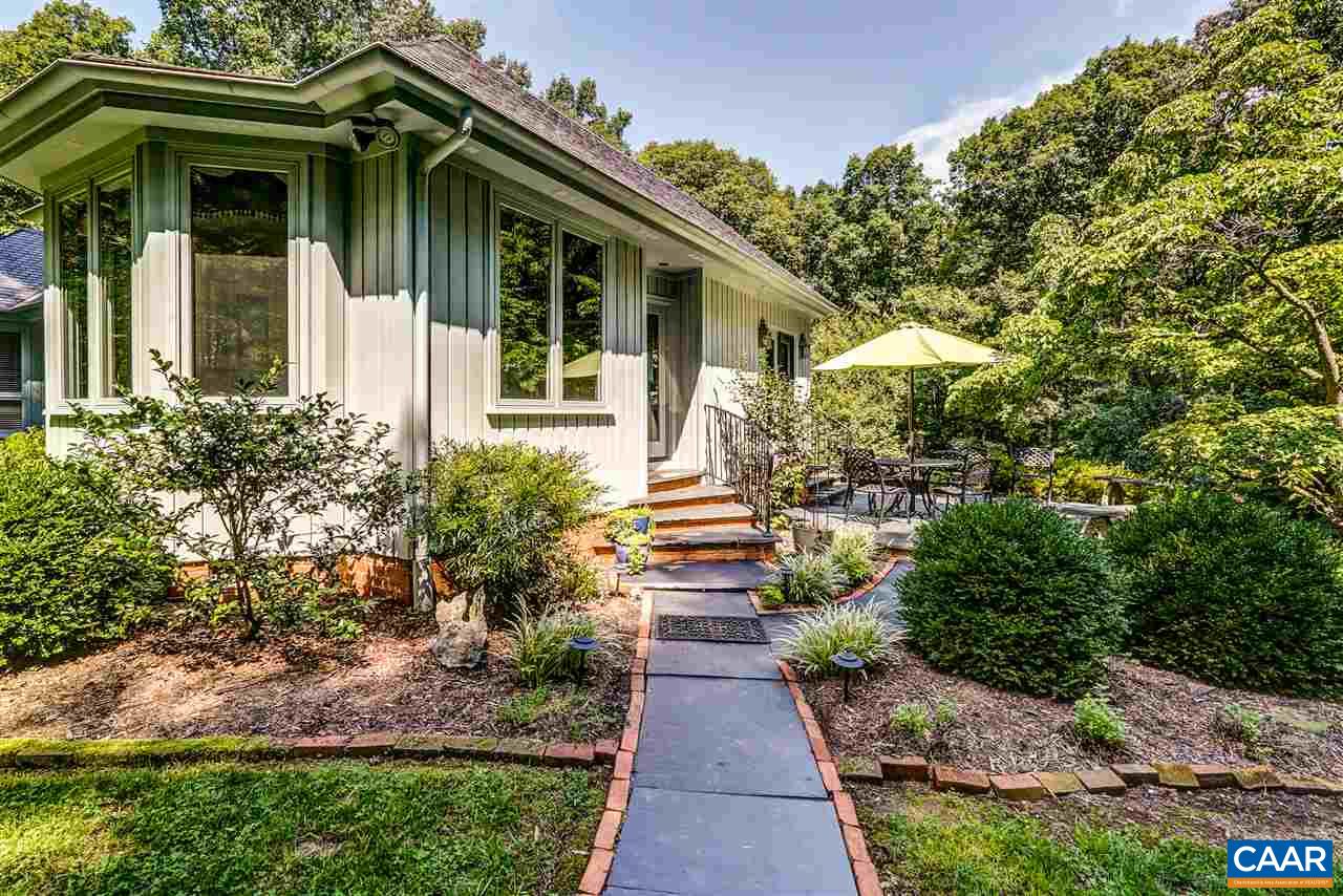 1075 Richmond Road Keswick, VA 22947 - Photo 45 of 50 a view of a pathway of house with potted plants