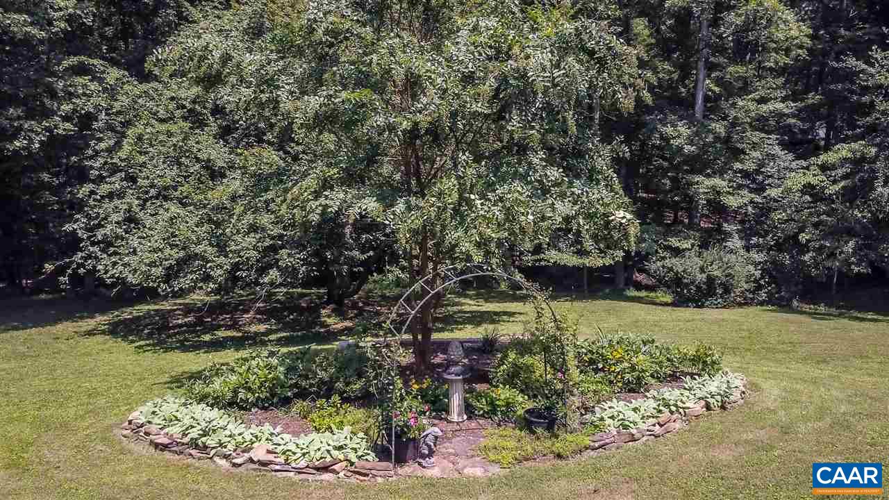 1075 Richmond Road Keswick, VA 22947 - Photo 48 of 50 a view of a garden with a tree