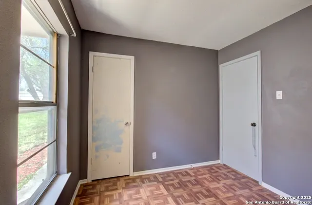 a view of an empty room and window