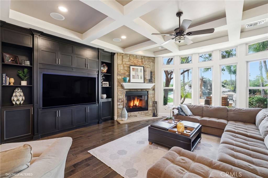 14779 Wood Riverside, CA 92508 - Photo 14 of 70 a living room with furniture a flat screen tv and a fireplace