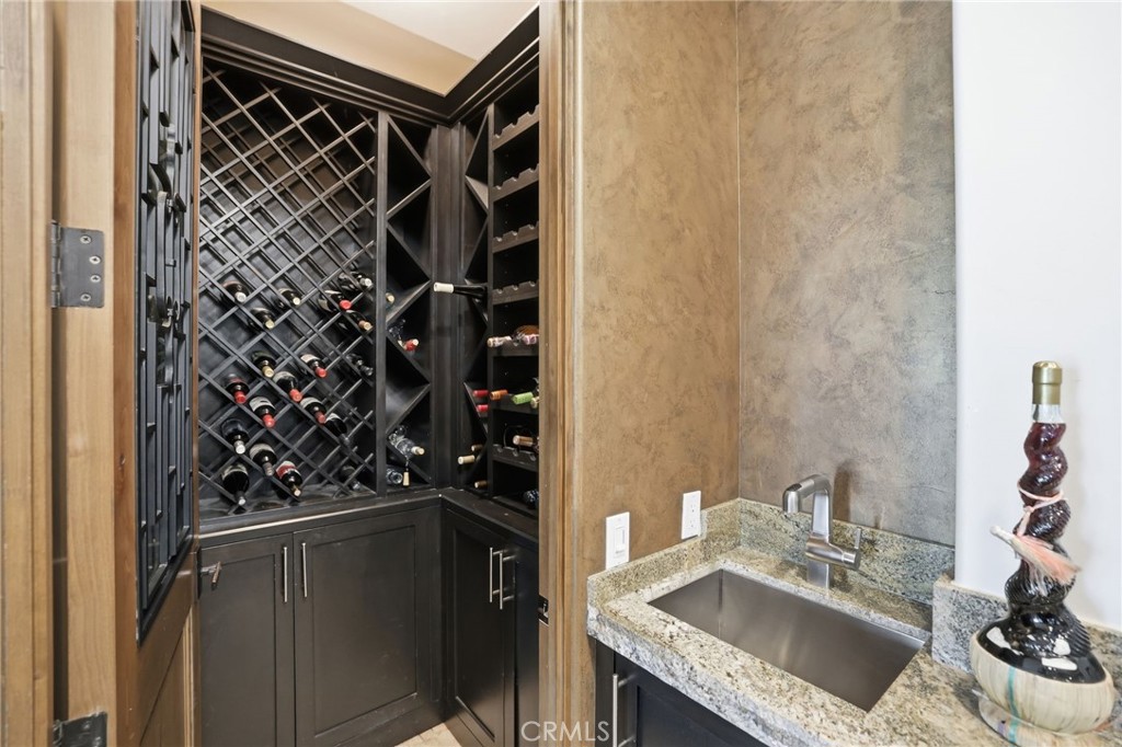 14779 Wood Riverside, CA 92508 - Photo 28 of 70 a bathroom with a granite countertop sink and a mirror