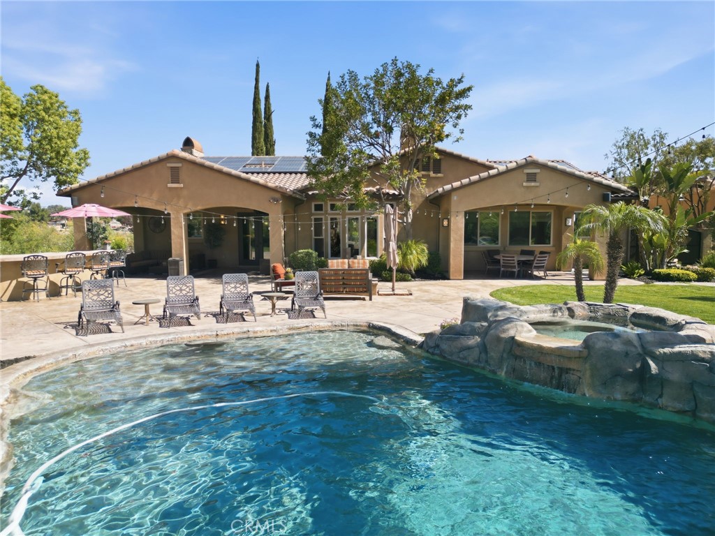 14779 Wood Riverside, CA 92508 - Photo 54 of 70 a view of a house with swimming pool and a yard