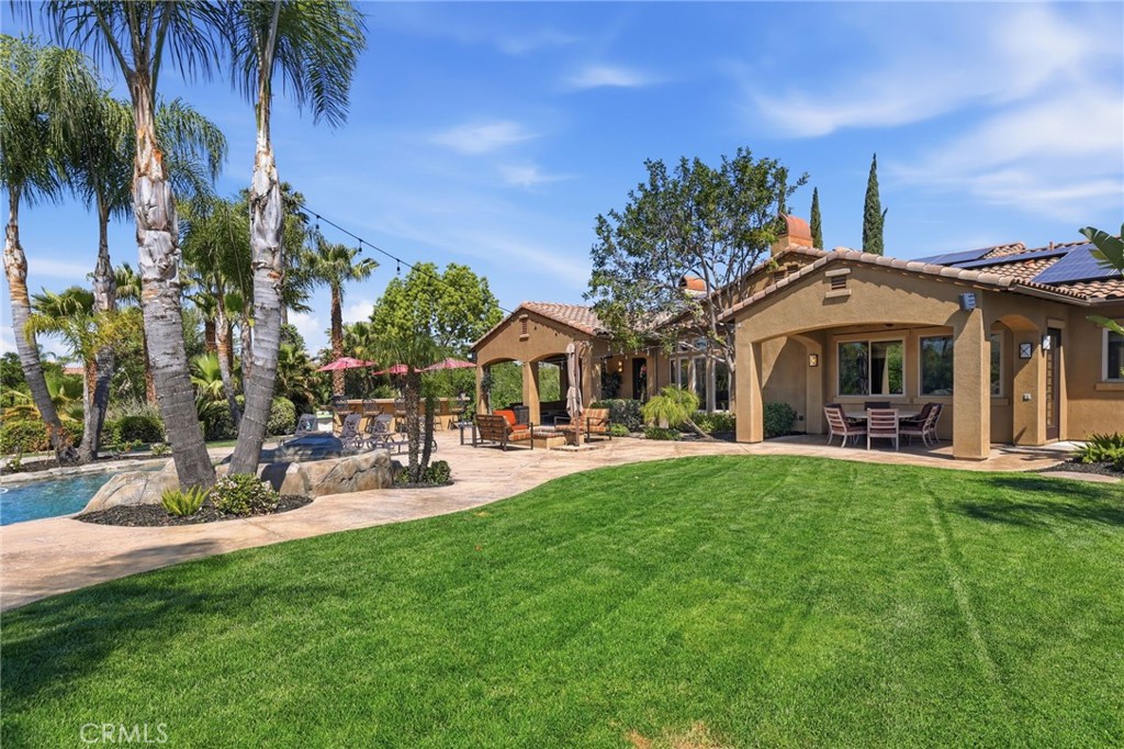 14779 Wood Riverside, CA 92508 - Photo 59 of 70 a front view of a house with swimming pool garden and outdoor seating