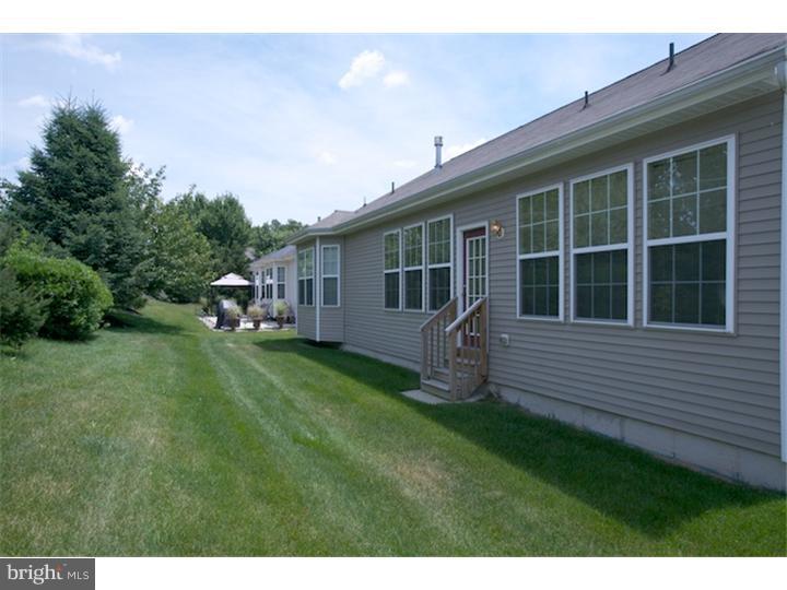 11 Michael Road Sicklerville, NJ 08081 - Photo 22 of 25 a backyard of a house with table and chairs