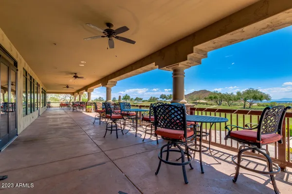 a view of a chairs and tables in the patio