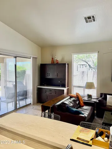 a living room with a couch and a flat screen tv