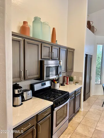 a kitchen with a stove and a sink