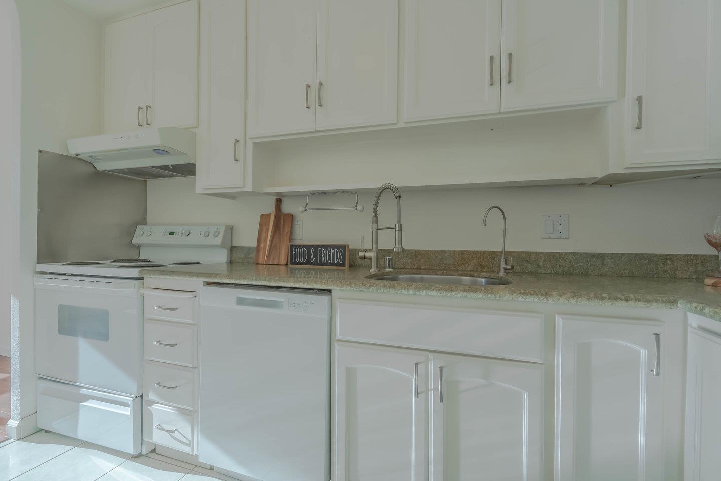 818 North Delaware Street, Unit 314 San Mateo, CA 94401 - Photo 3 of 18 a kitchen with white cabinets and a sink