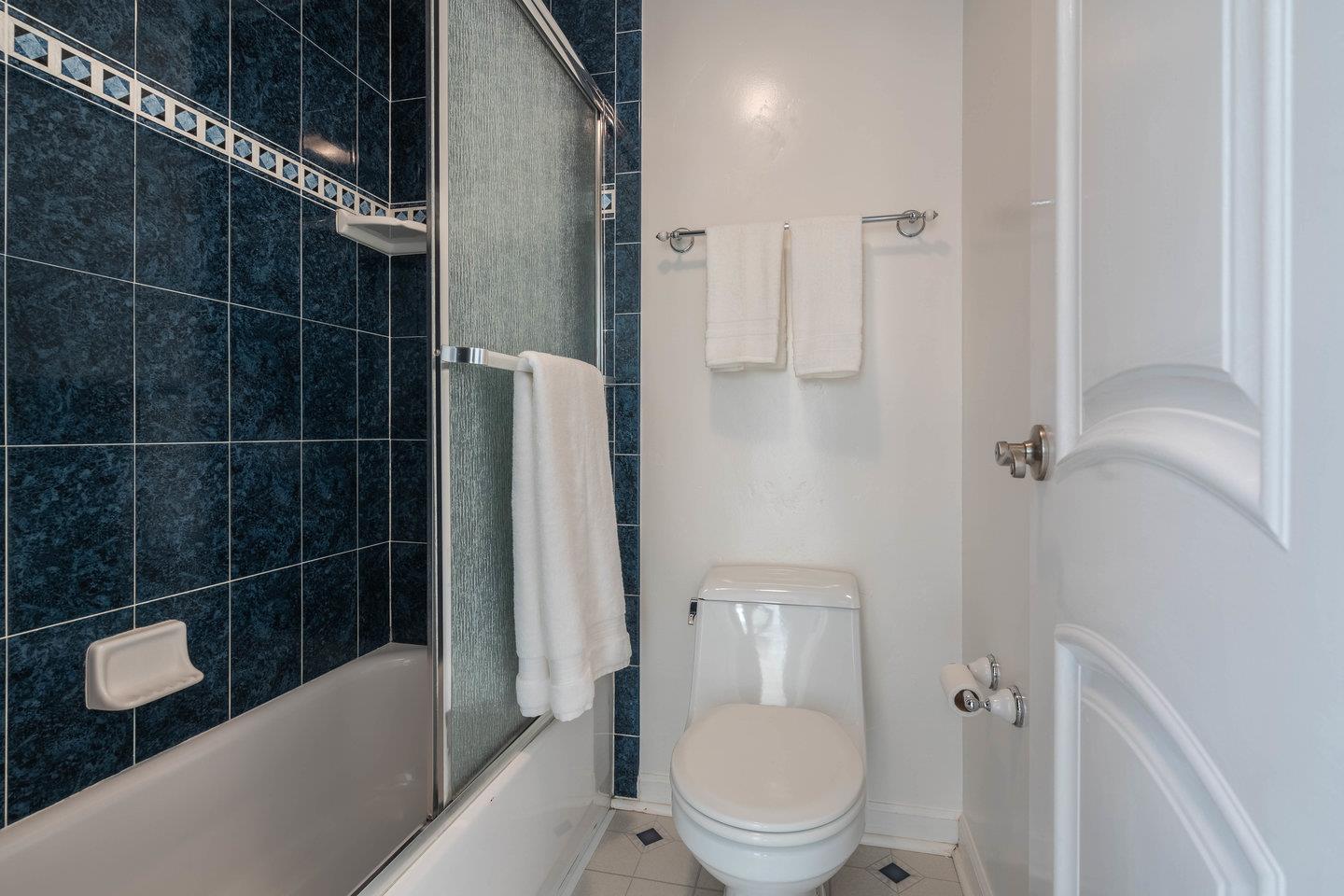 818 North Delaware Street, Unit 314 San Mateo, CA 94401 - Photo 10 of 18 a bathroom with a toilet and a shower