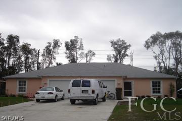 8164 Matanzas Road Fort Myers, FL 33967 - Photo 1 of 9 a car parked in front of house
