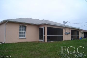 8164 Matanzas Road Fort Myers, FL 33967 - Photo 2 of 9 a front view of a house with a garden