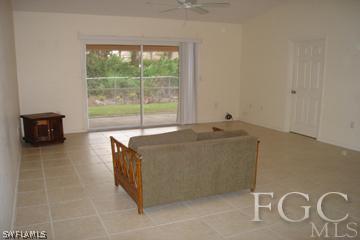 8164 Matanzas Road Fort Myers, FL 33967 - Photo 4 of 9 a room with a bed and a mirror