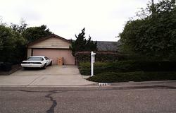 a view of street with parked cars
