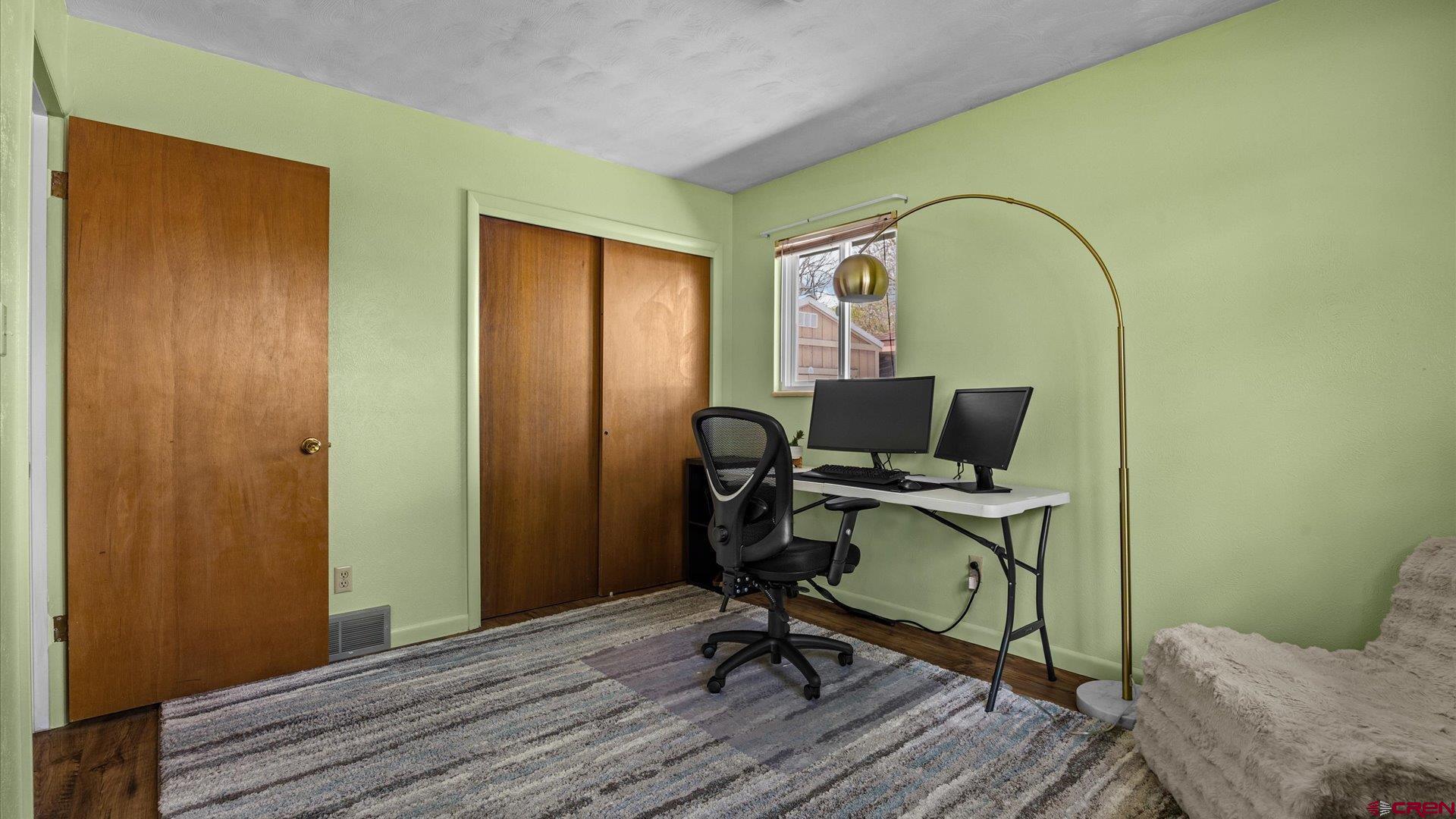 1424 Dover Road Montrose, CO 81401 - Photo 12 of 44 a view of a workspace with furniture and a window