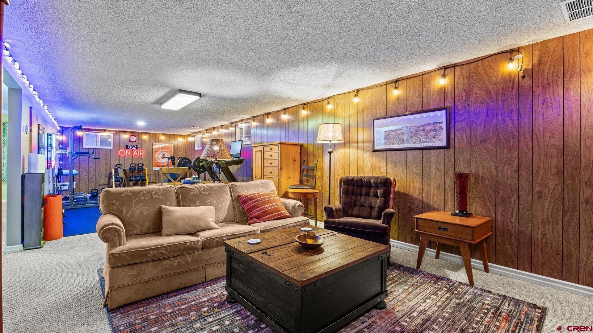 1424 Dover Road Montrose, CO 81401 - Photo 18 of 44 a living room with furniture and a wooden floor