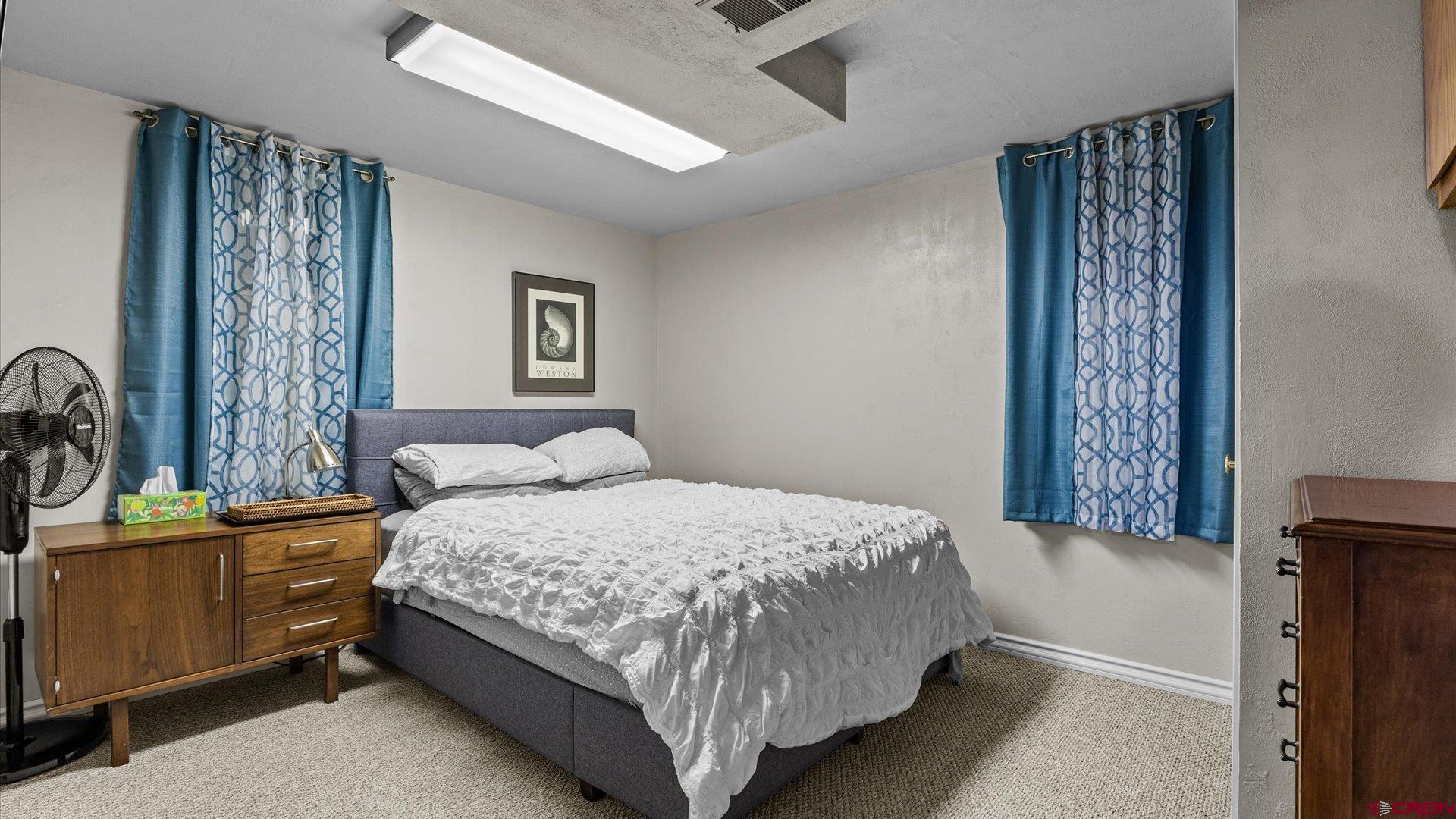 1424 Dover Road Montrose, CO 81401 - Photo 20 of 44 a bedroom with a bed and a table