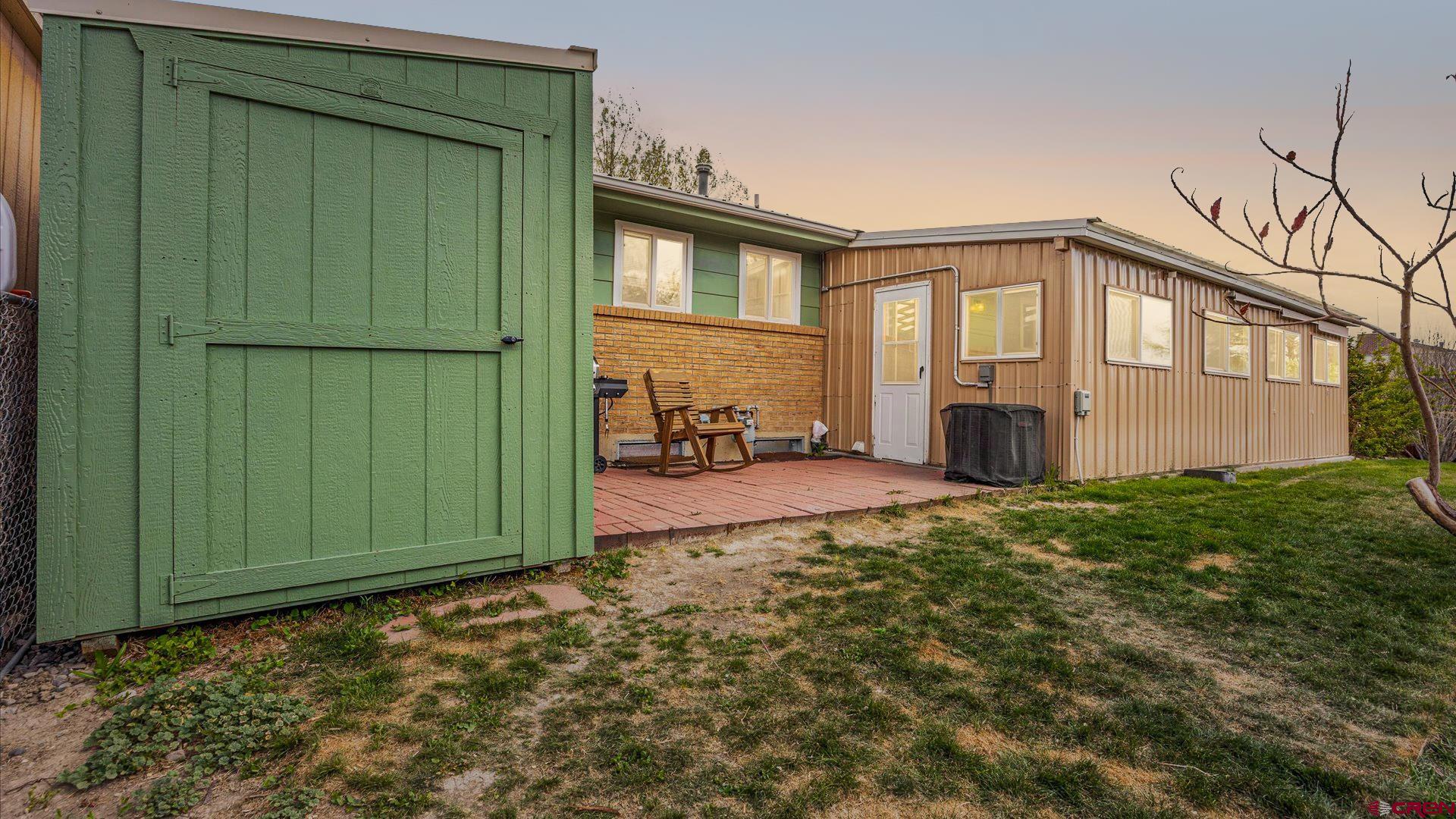 1424 Dover Road Montrose, CO 81401 - Photo 26 of 44 a view of a house with backyard and garden