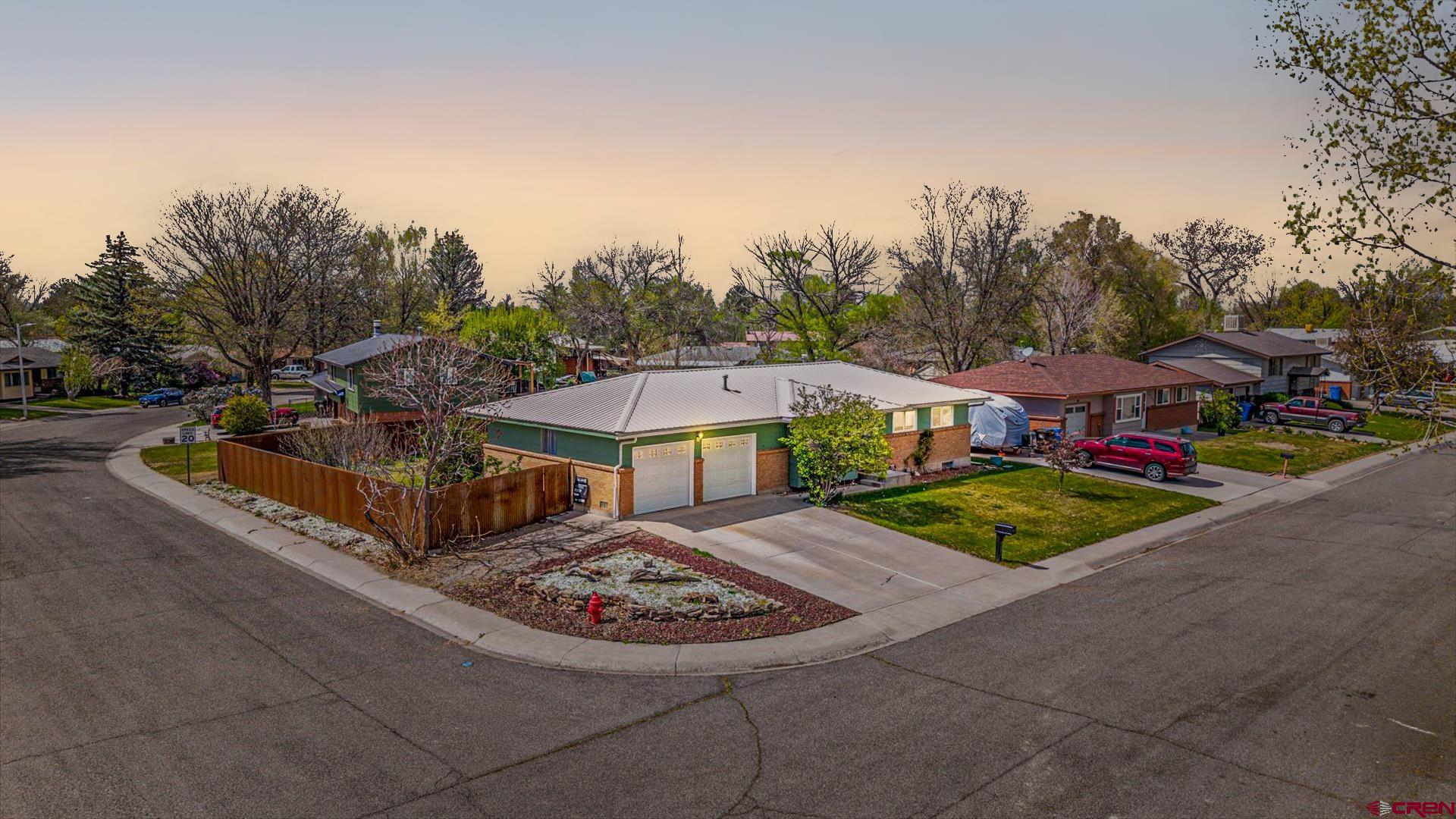 1424 Dover Road Montrose, CO 81401 - Photo 3 of 44 a view of a street with a large trees