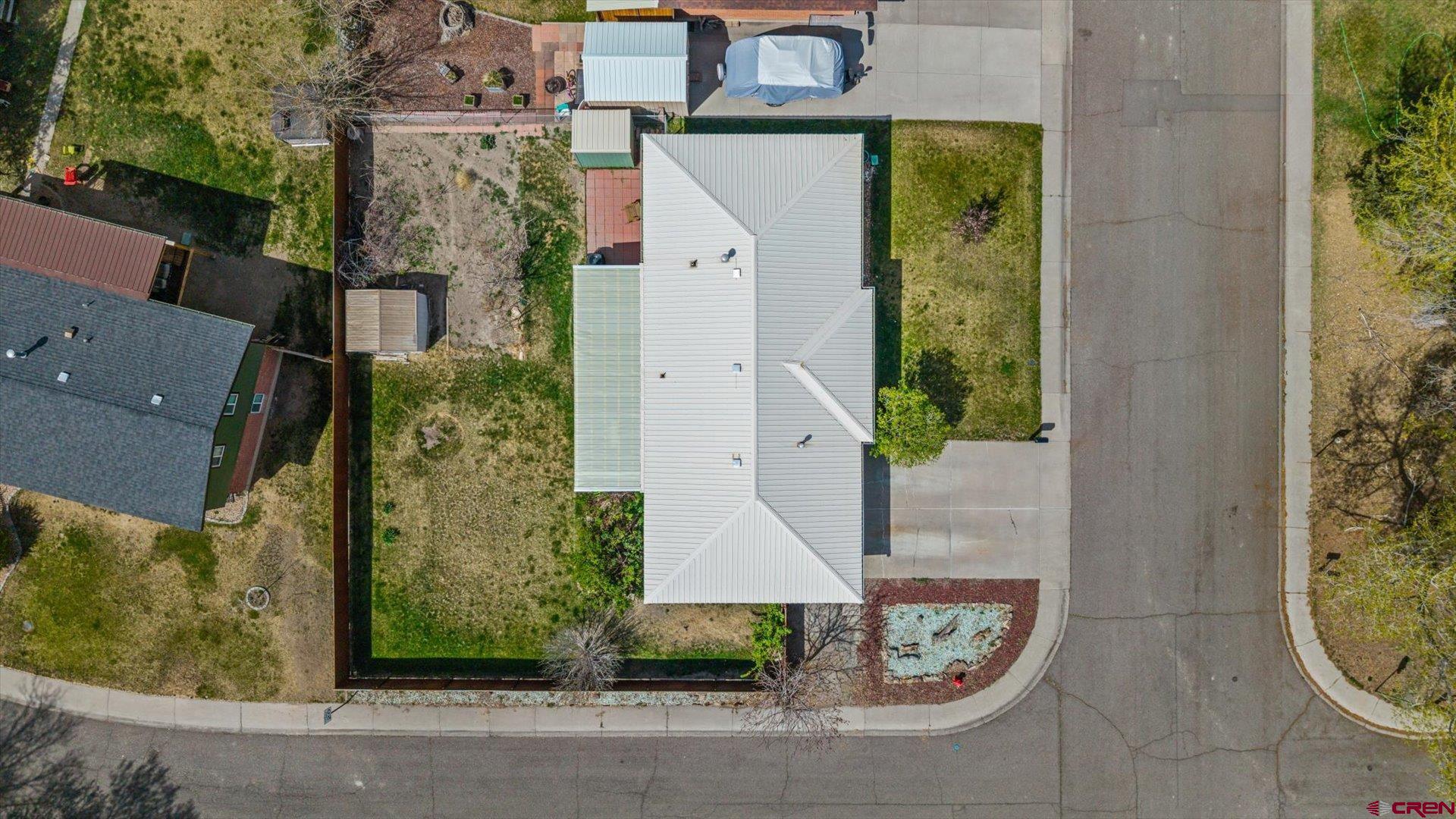 1424 Dover Road Montrose, CO 81401 - Photo 32 of 44 an aerial view of a house with a garden and entryway