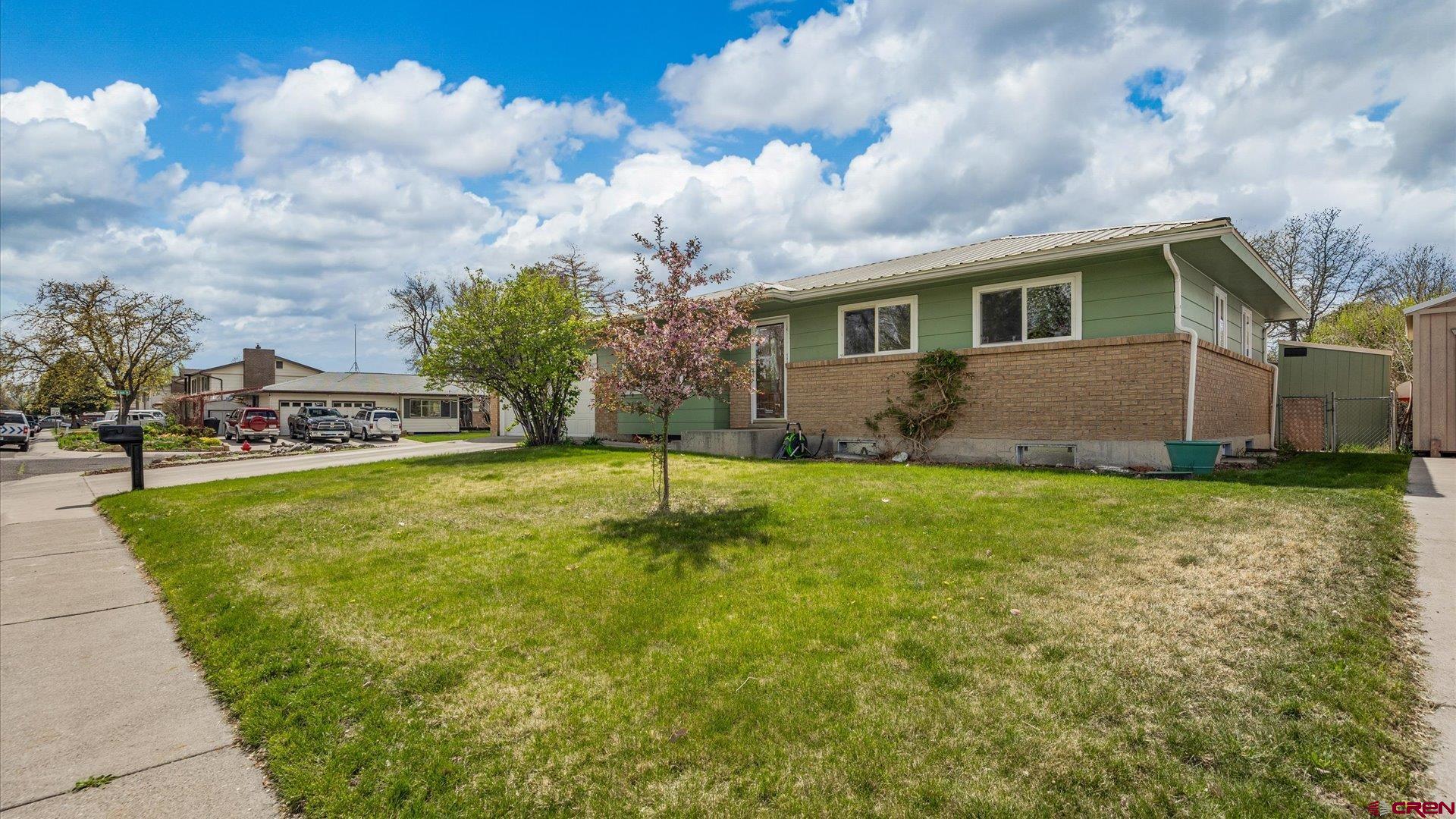 1424 Dover Road Montrose, CO 81401 - Photo 38 of 44 a view of a house with pool and a yard