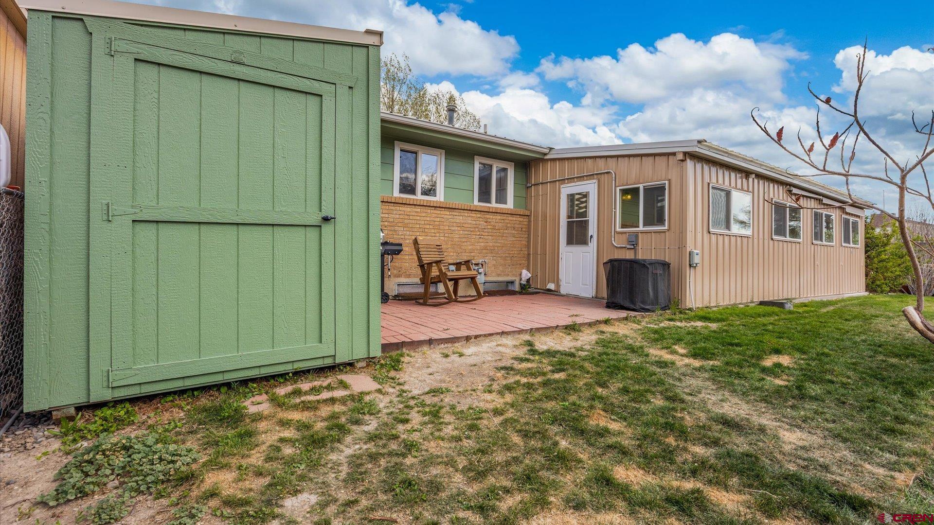 1424 Dover Road Montrose, CO 81401 - Photo 41 of 44 a view of a house with backyard and garden