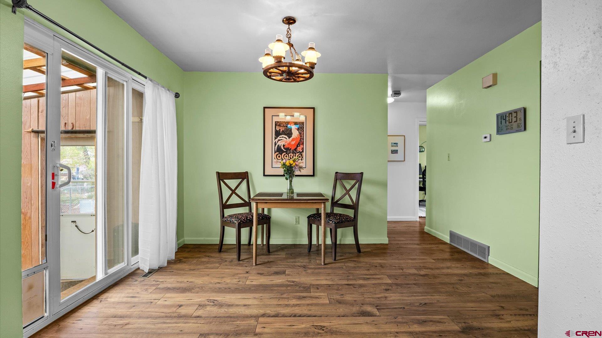 1424 Dover Road Montrose, CO 81401 - Photo 10 of 44 a view of a dining room with furniture window and wooden floor