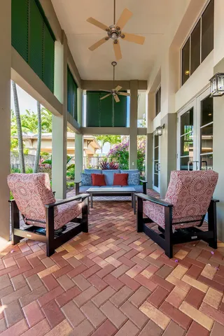 a living room with furniture and a dining table