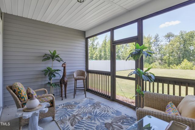 a view of a porch with furniture