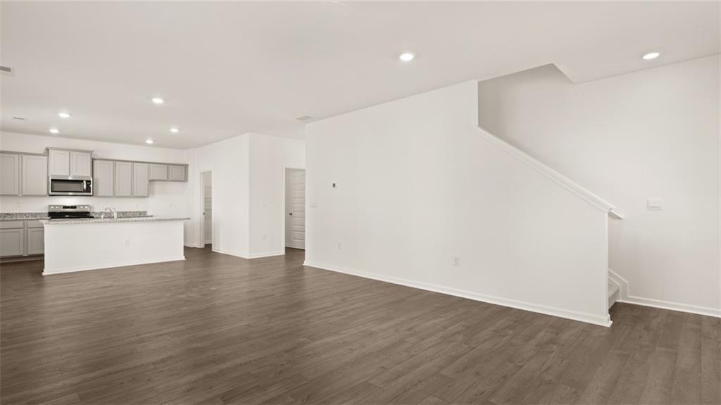 69 White Spruce Way Newnan, GA 30265 - Photo 16 of 40 a view of kitchen with wooden floor
