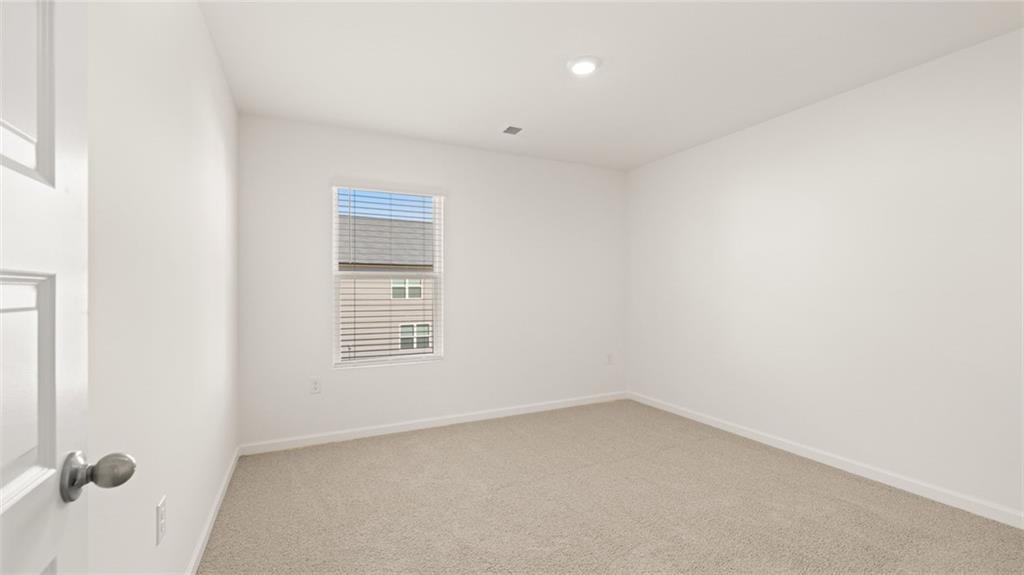 69 White Spruce Way Newnan, GA 30265 - Photo 29 of 40 a view of an empty room with a window
