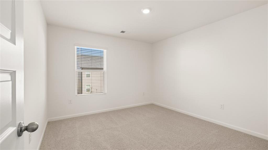 69 White Spruce Way Newnan, GA 30265 - Photo 31 of 40 an empty room with a window