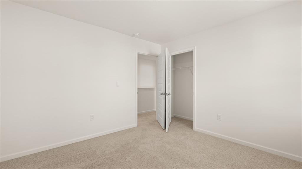 69 White Spruce Way Newnan, GA 30265 - Photo 32 of 40 a view of an empty room