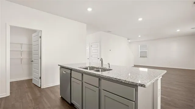 a kitchen with a sink and cabinets
