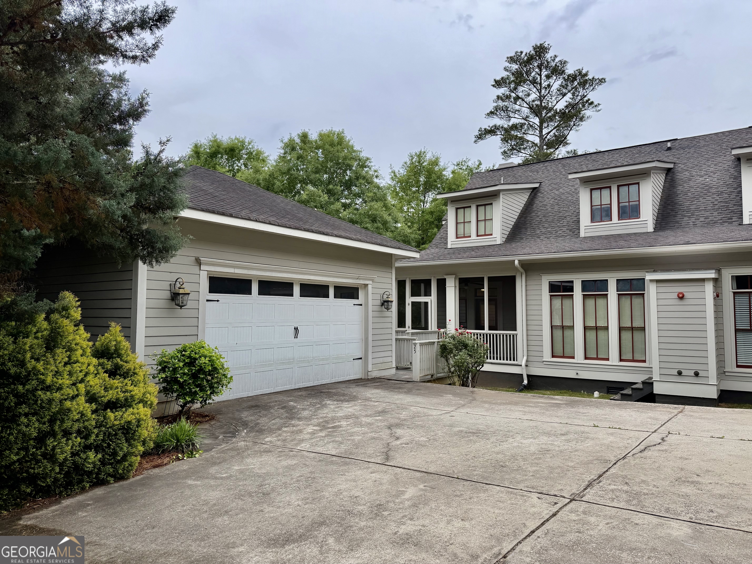 25 Charter Oak Drive Athens, GA 30607 - Photo 5 of 19 a front view of a house with a garden