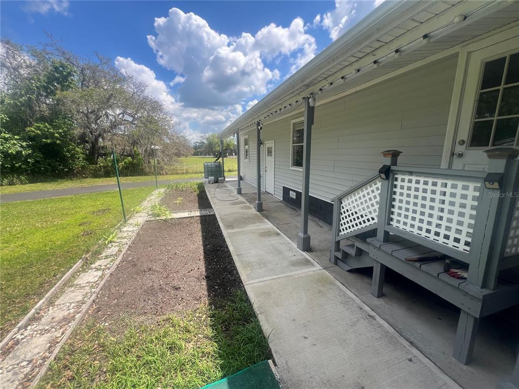 5855 Jack Brack Road St. Cloud, FL 34771 - Photo 84 of 86 a view of a backyard with sitting area