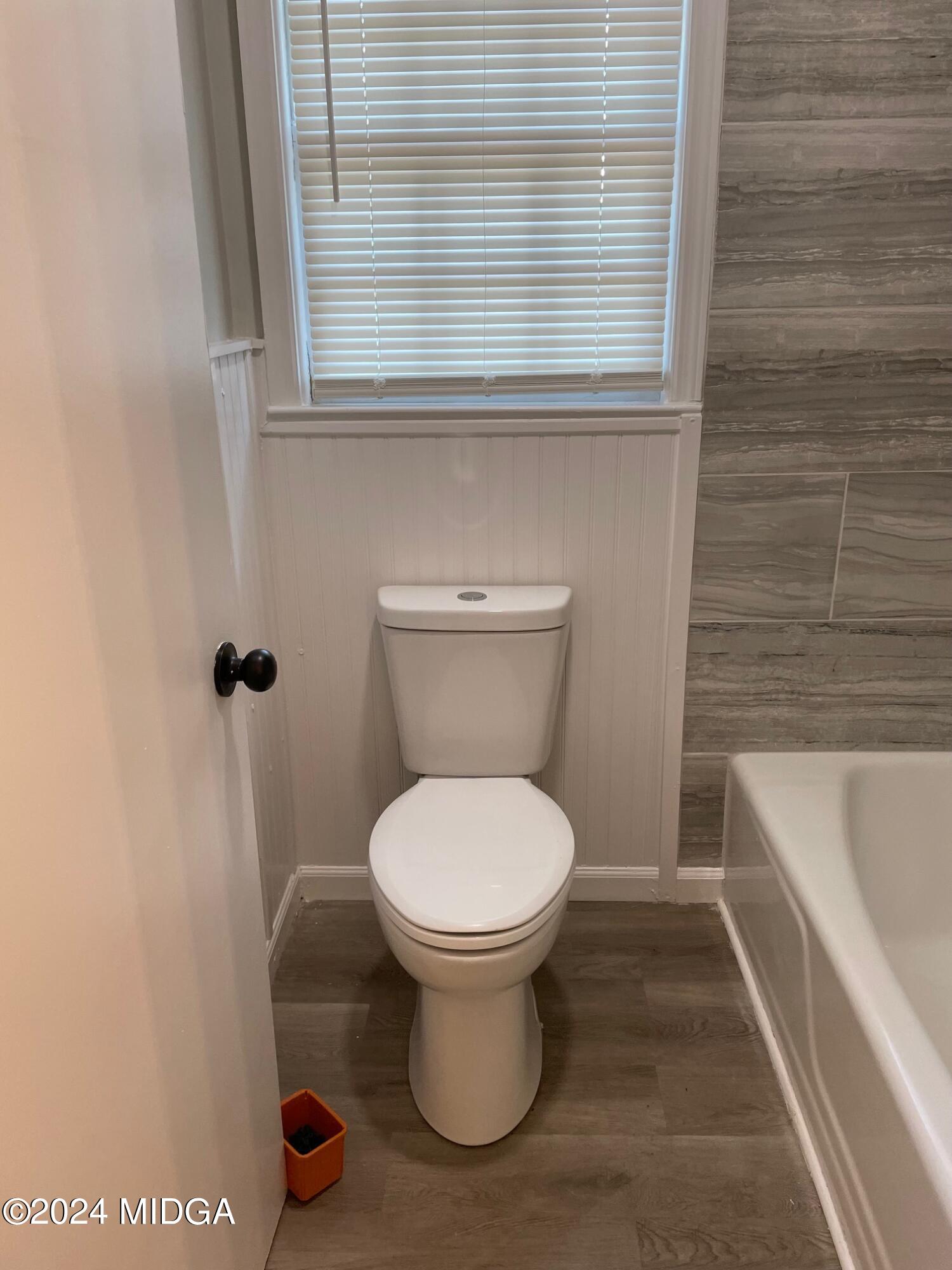 2069 Manson Road Macon, GA 31217 - Photo 13 of 15 a bathroom with a toilet and a bathtub