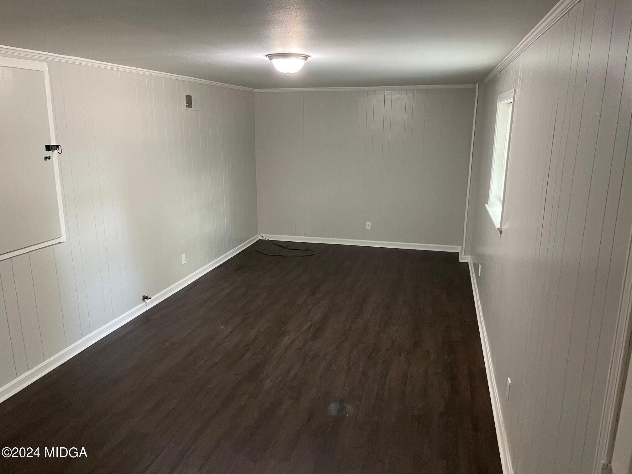 2069 Manson Road Macon, GA 31217 - Photo 8 of 15 an empty room with wooden floor