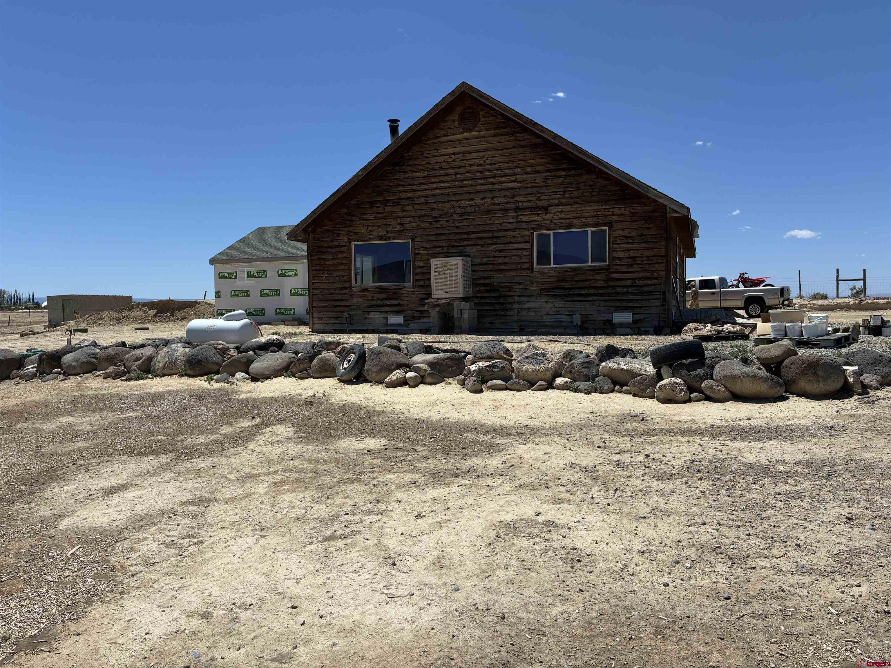 4491 2300th Road Delta, CO 81416 - Photo 1 of 25 a front view of a house with a yard