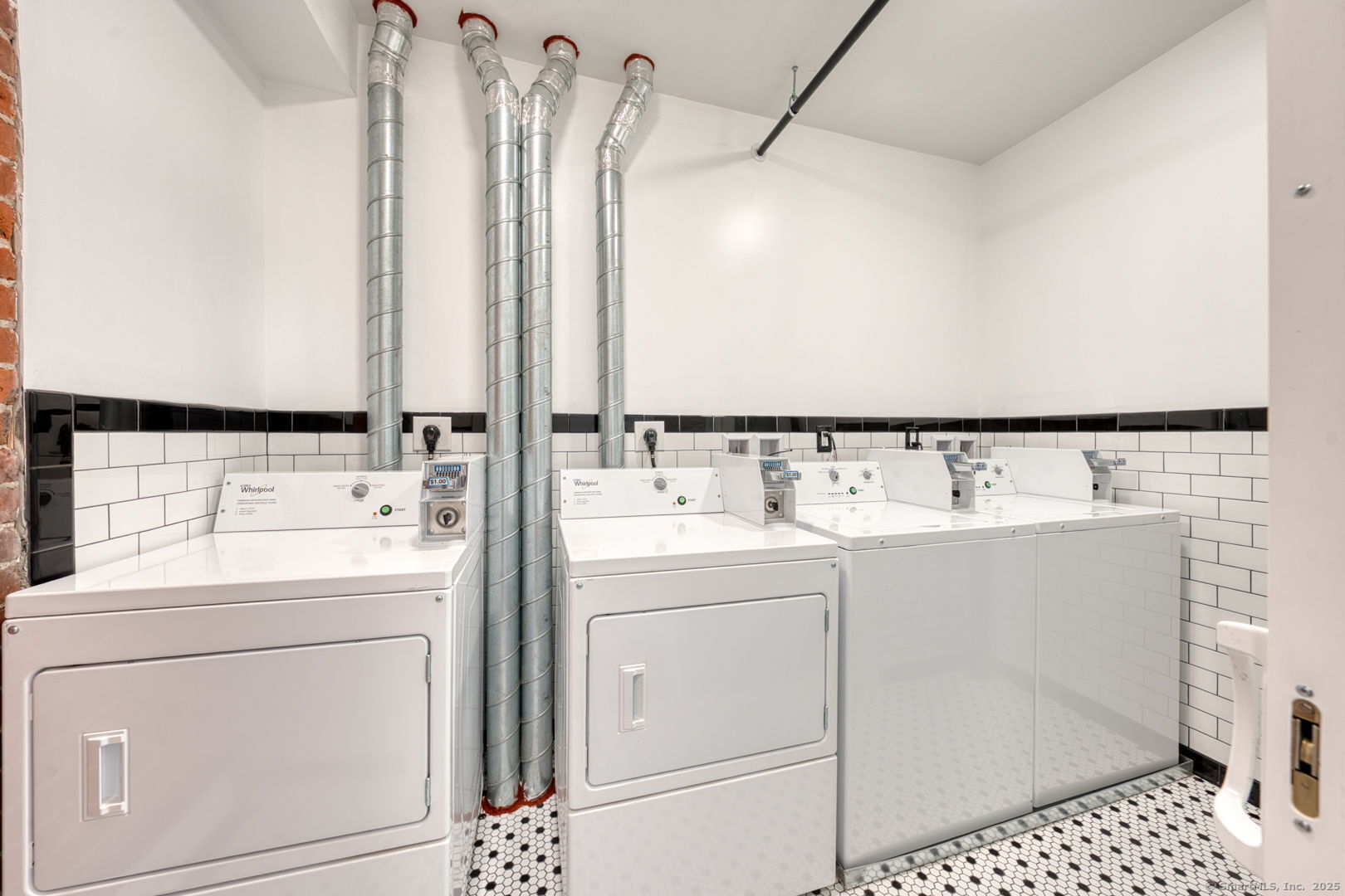 11 Main Street, Unit 301 Torrington, CT 06790 - Photo 12 of 14 a utility room with a washer and dryer