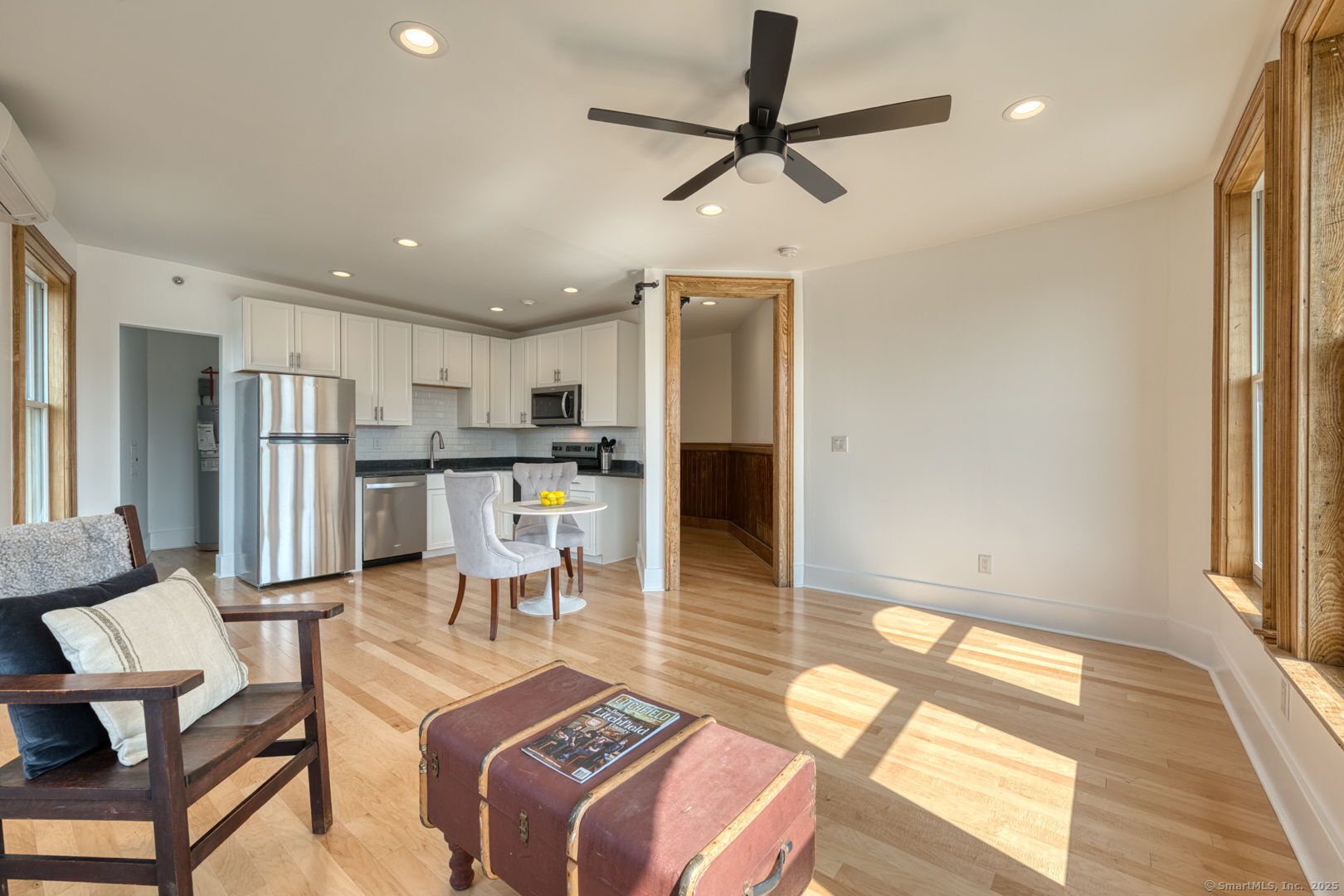 11 Main Street, Unit 301 Torrington, CT 06790 - Photo 3 of 14 a living room with stainless steel appliances kitchen island granite countertop furniture and a kitchen view