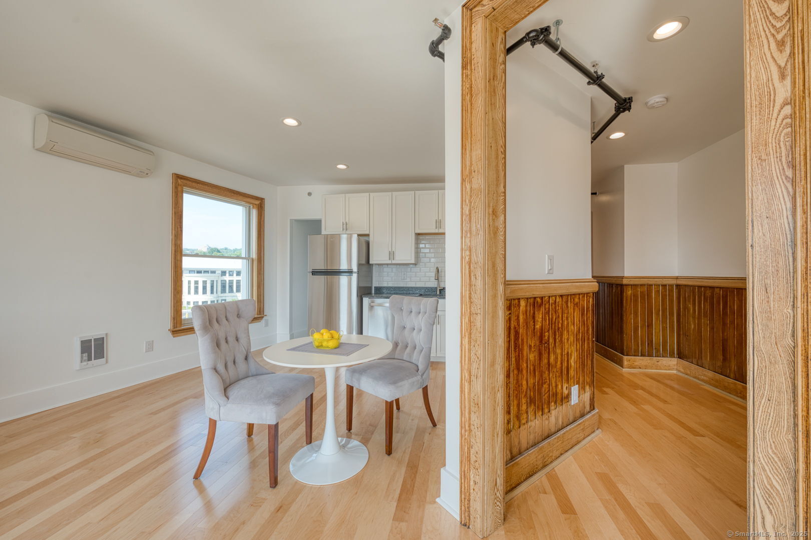 11 Main Street, Unit 301 Torrington, CT 06790 - Photo 7 of 14 a view of a dining room with furniture