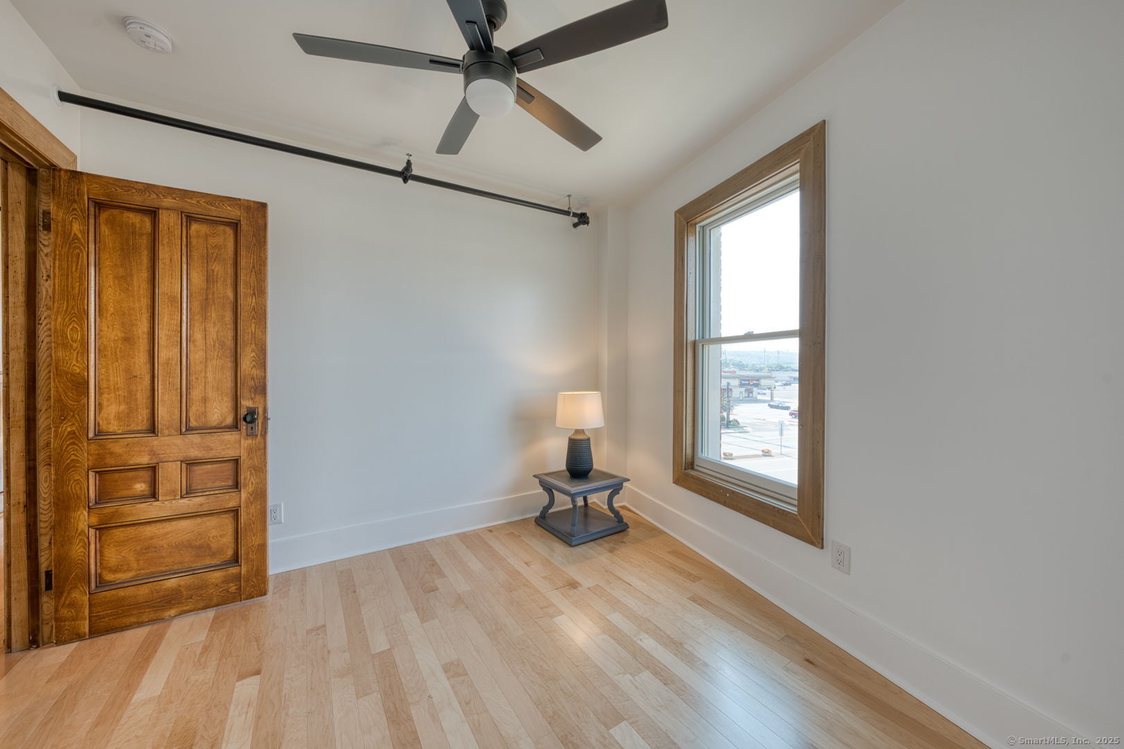 11 Main Street, Unit 301 Torrington, CT 06790 - Photo 10 of 14 a view of a room with wooden floor cabinet and windows