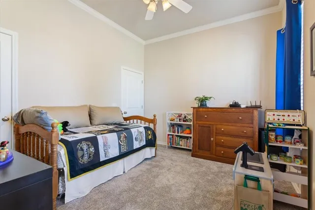 a bedroom with furniture and book shelf