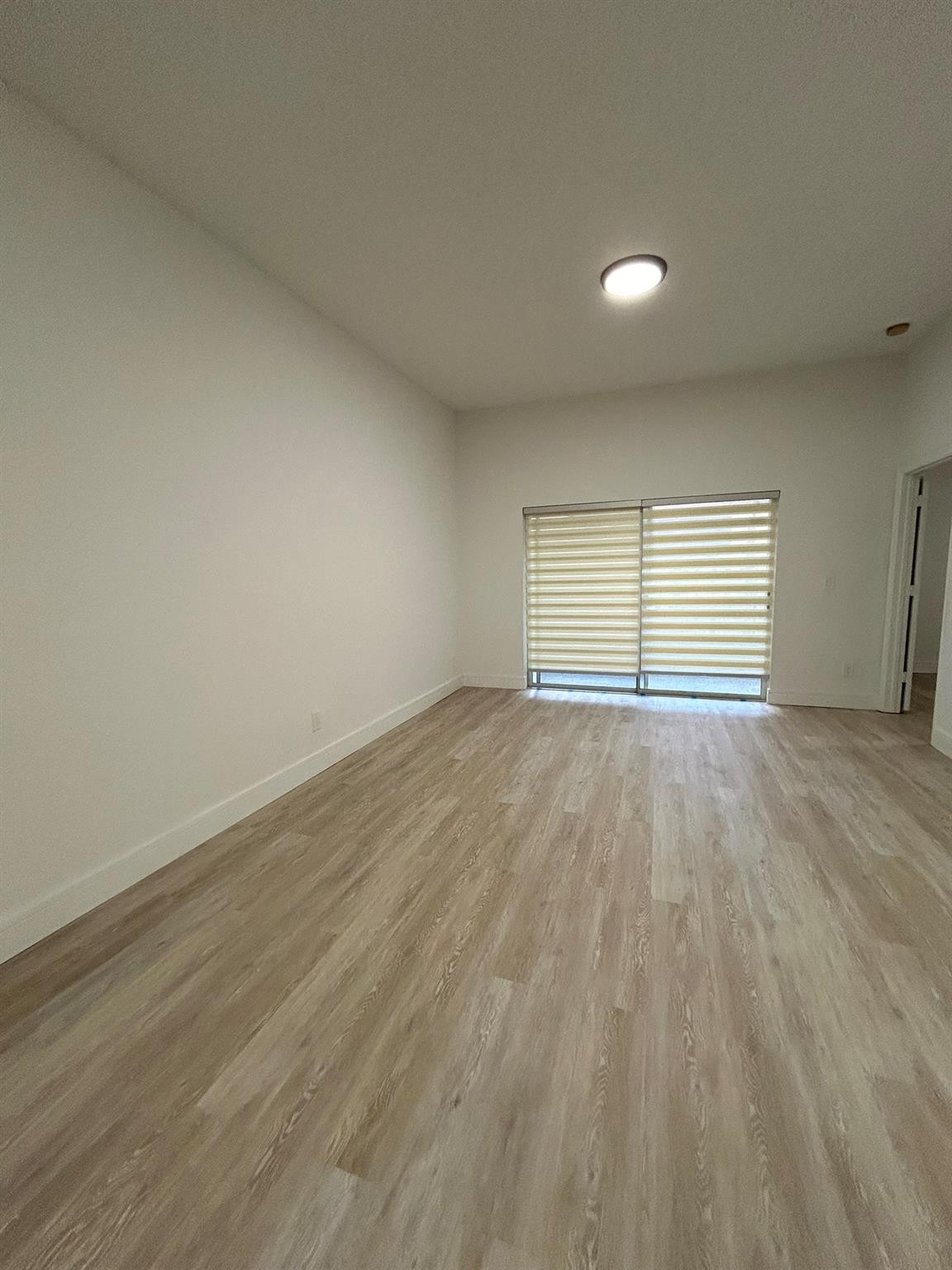 16223 Emerald Cove Road, Unit 16223 Weston, FL 33331 - Photo 14 of 38 wooden floor in an empty room with a window