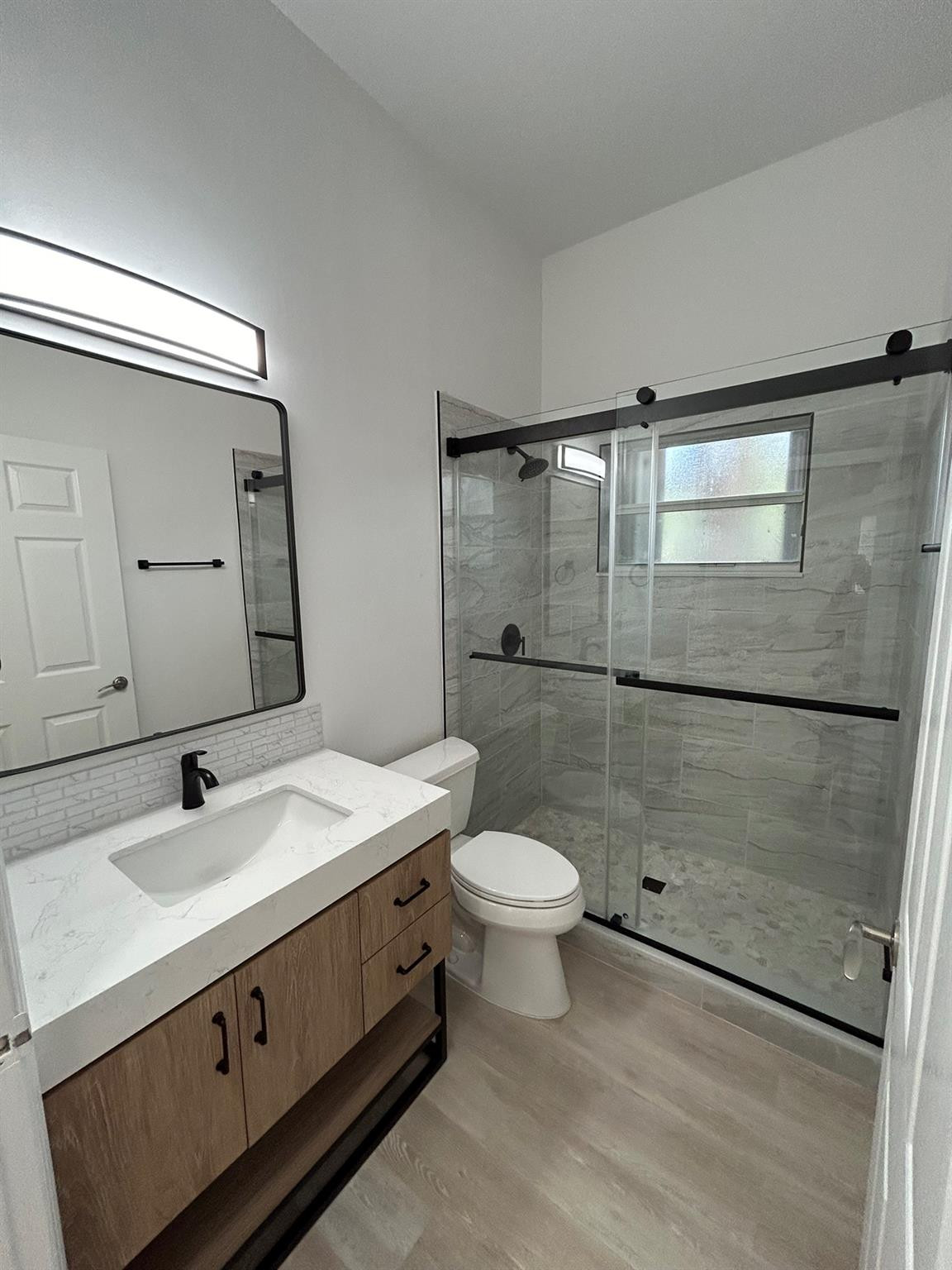 16223 Emerald Cove Road, Unit 16223 Weston, FL 33331 - Photo 18 of 38 a bathroom with a sink a toilet and shower